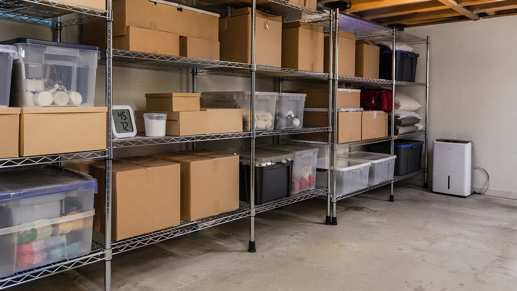 Storage room with boxes and bins arranged on shelves to prevent mold