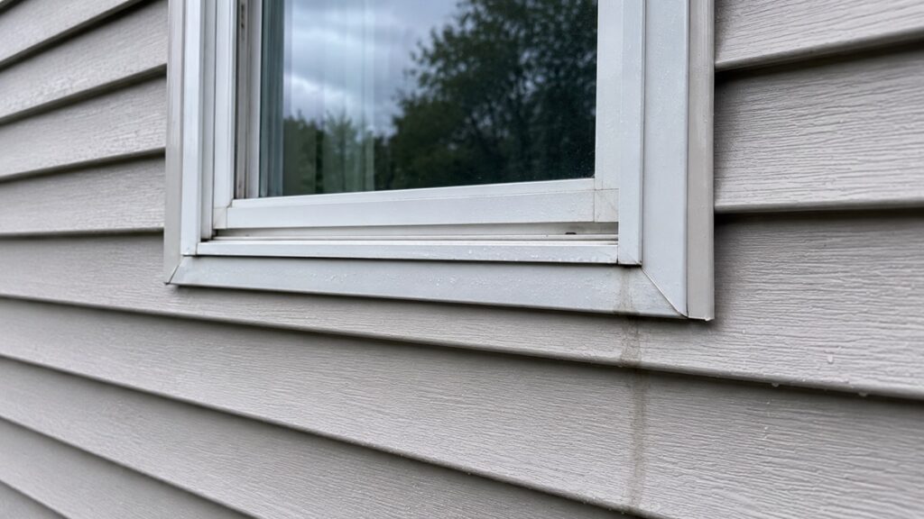 Subtle exterior water entry risk around siding and trim after light rain